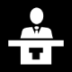 Lecturer-at-podium on black 80 smaller